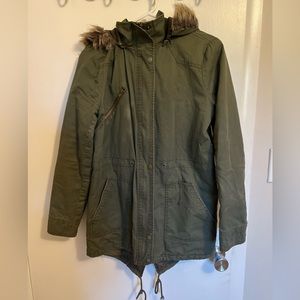 Green jacket with fur hood